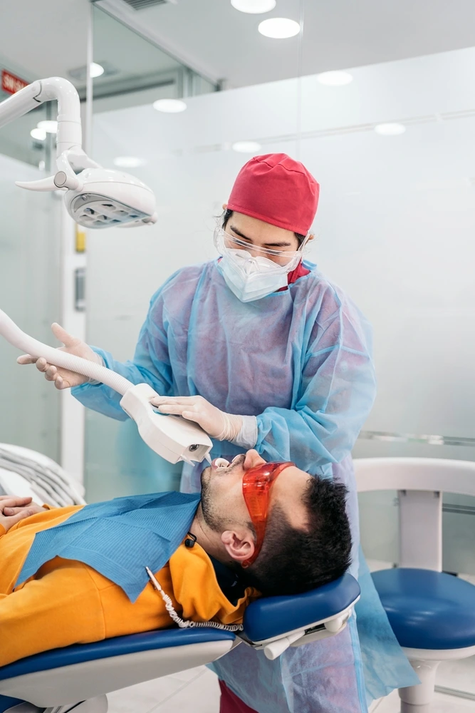 Dentist prepares a patient for in-chair teeth whitening at Clearly Dental Dapto.